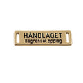 gullfarget skilt "håndlaget - begrenset opplag"