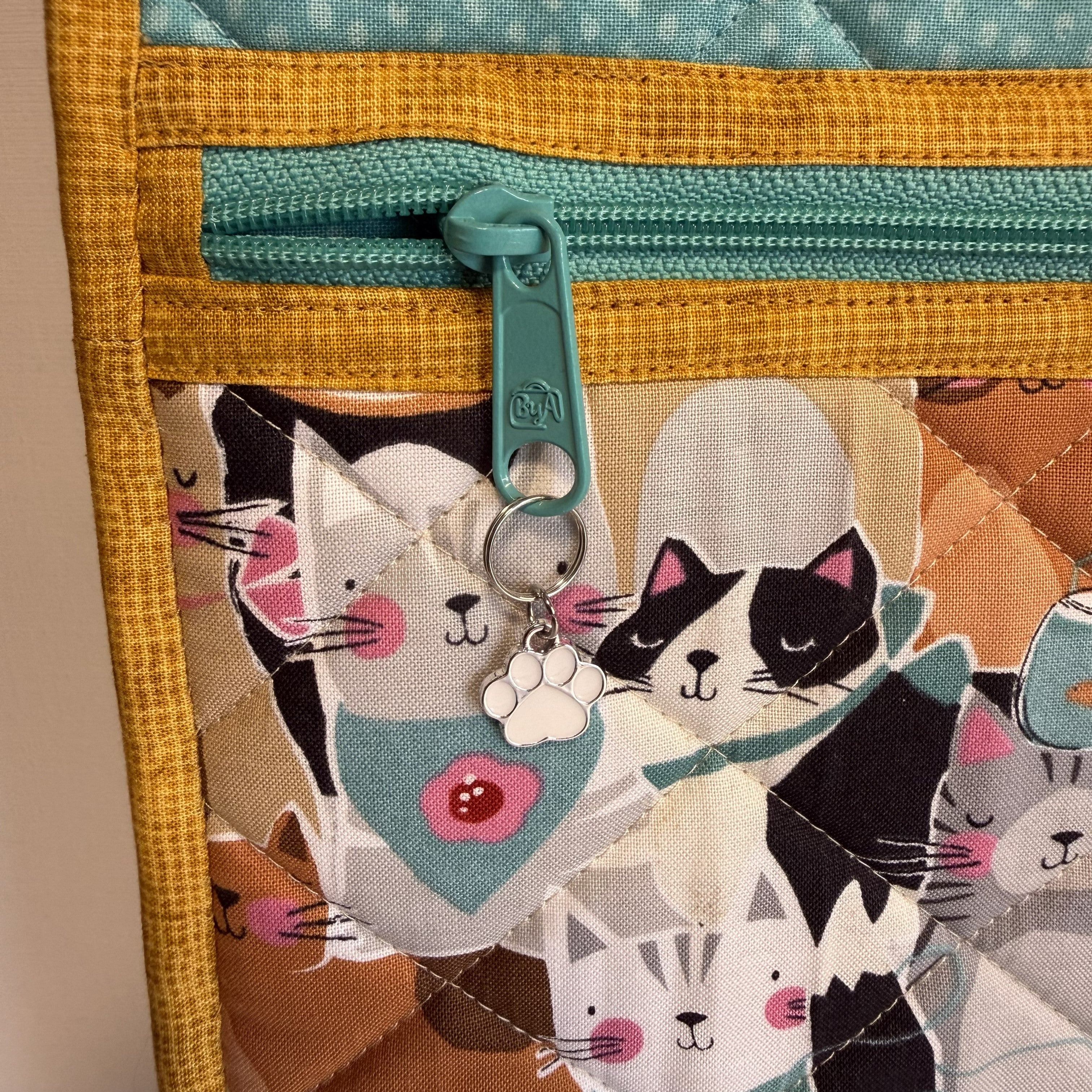Skulderveske Packed Cats i turkis og beige
